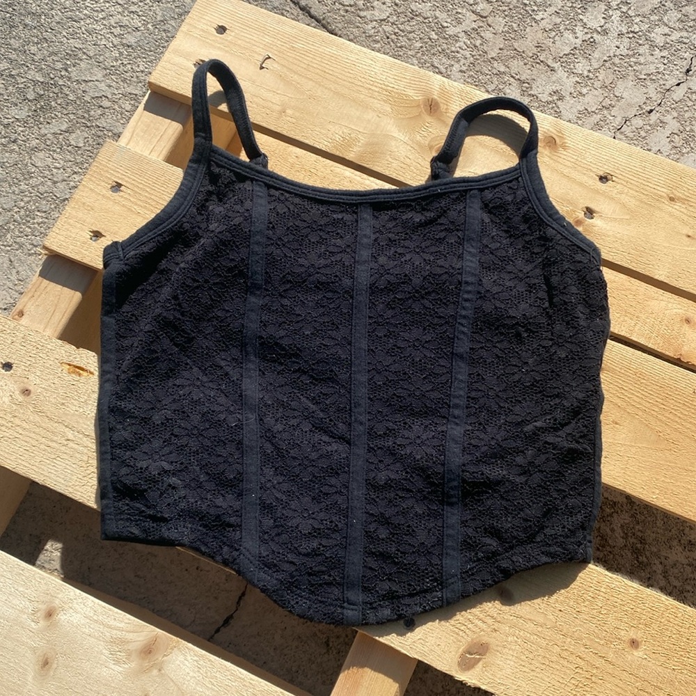 Black extra small tank with adjustable straps and lace flower design on front
